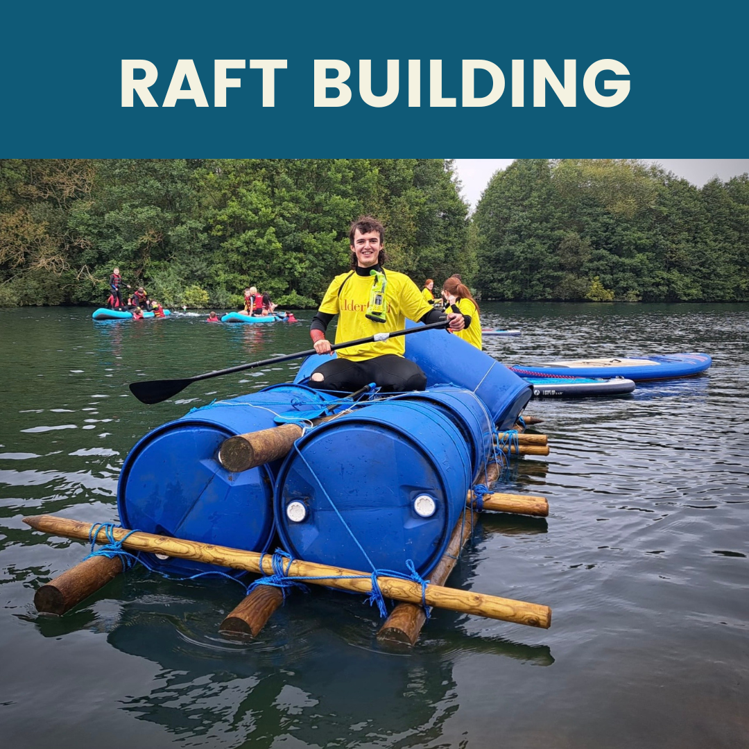 Person rowing on a raft built out of barrels and wood