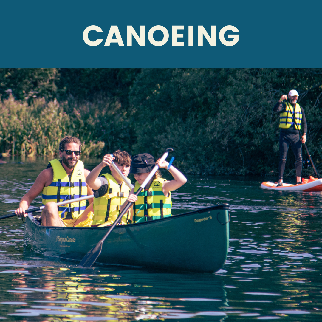 Family rowing a canoe