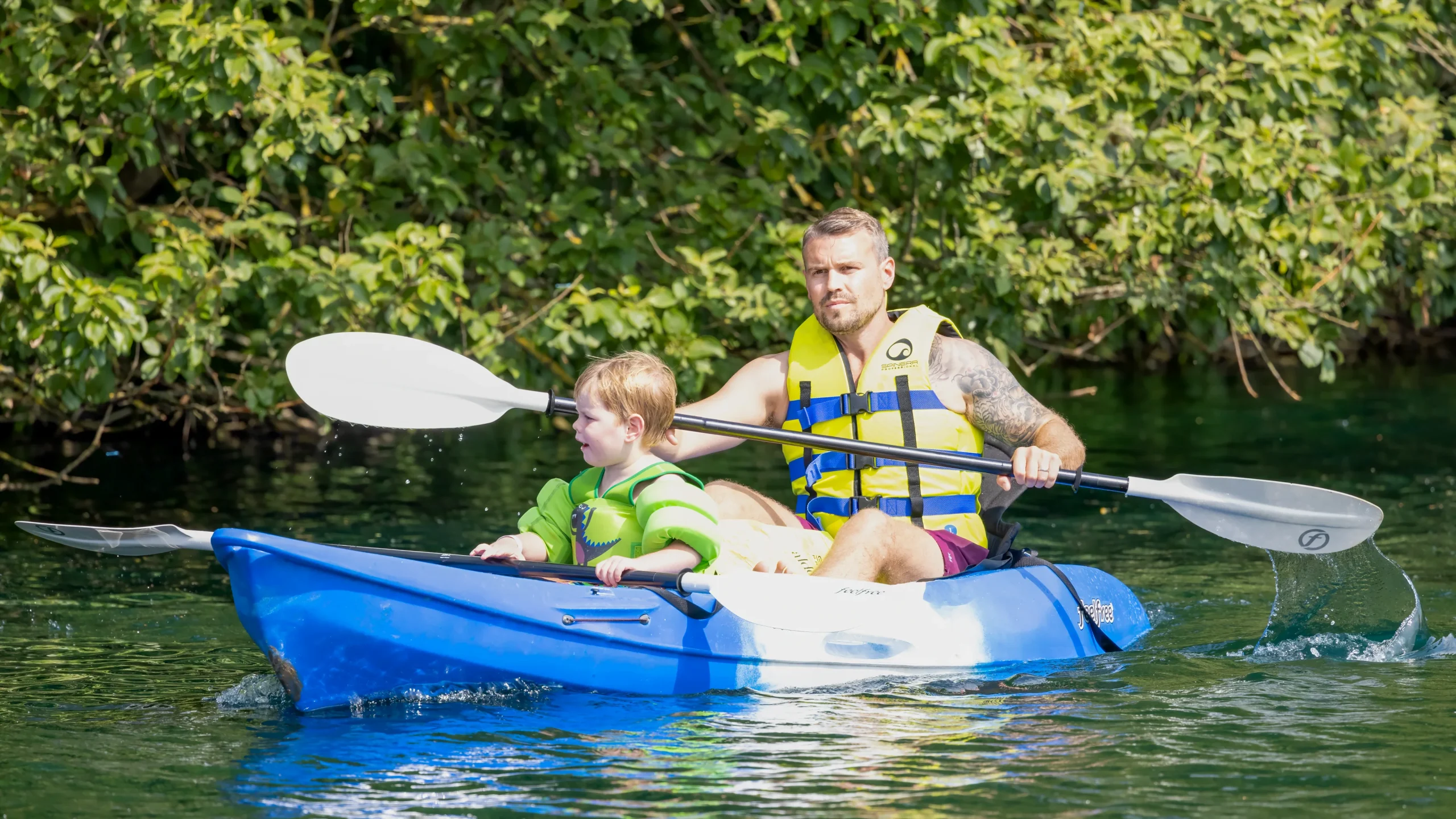 Man and Child Kayaking