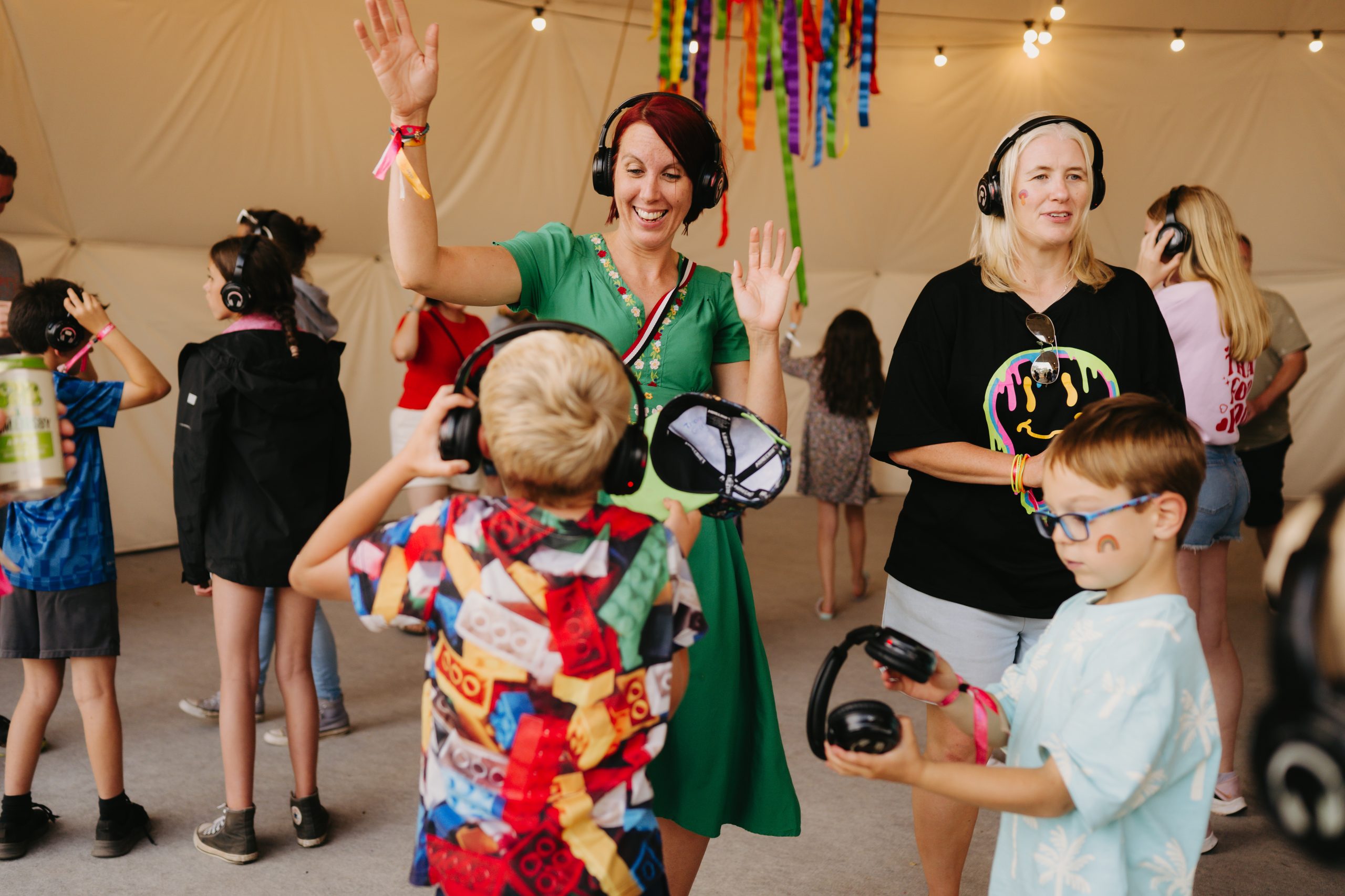 Children with headphones at an event