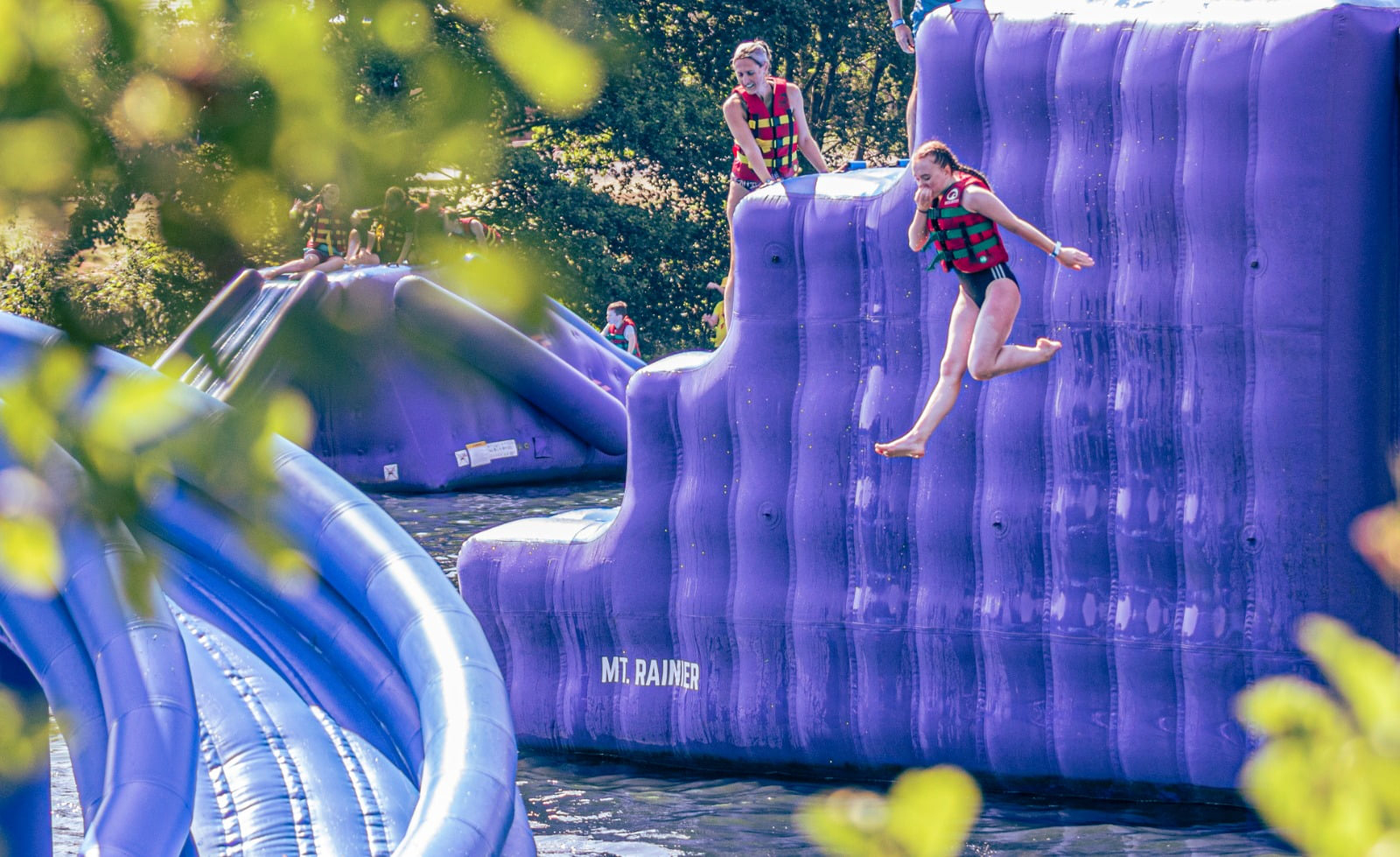 People on Inflatable Water Slide