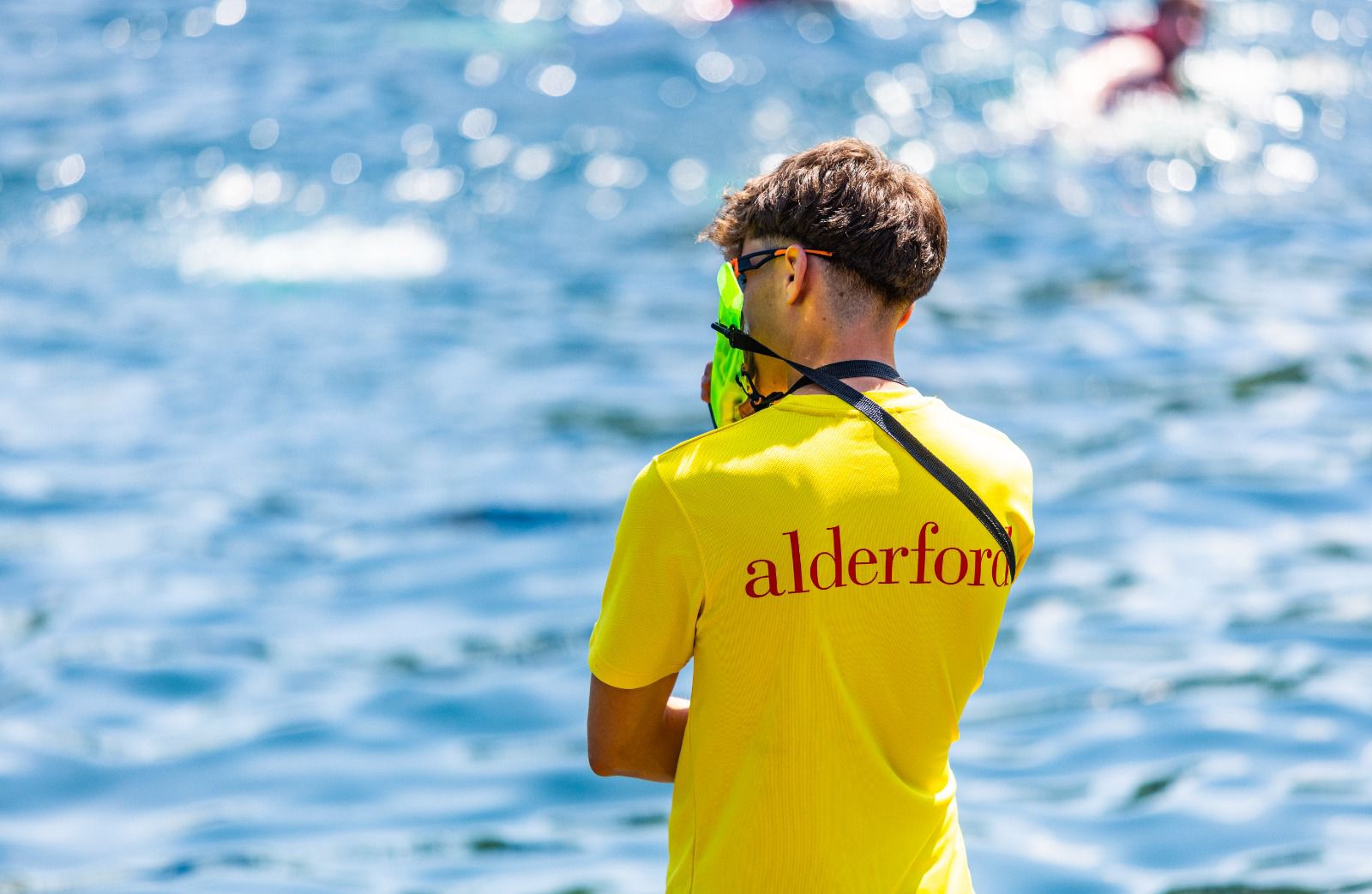 Man in Yellow Lifeguard Shirt